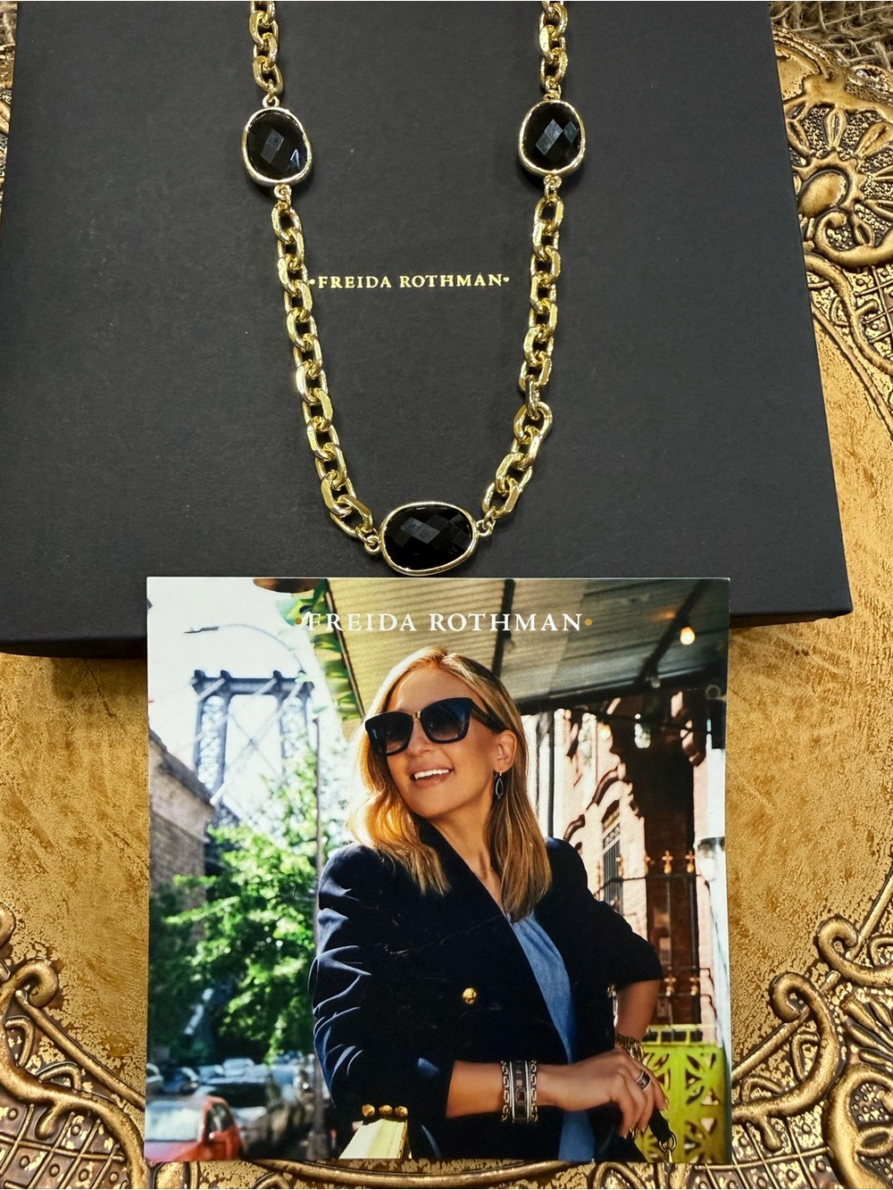 Freida Rothman “vault”-Brass base, gold tone necklace with black faceted stones